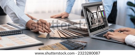 Group of interior architect designer team at table choosing various mood board samples with architecture software on laptop screen. Modern renovation and interior material selection concept. Insight Royalty-Free Stock Photo #2323280087