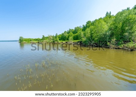 Spring photography, river full flow Kama, blue sky