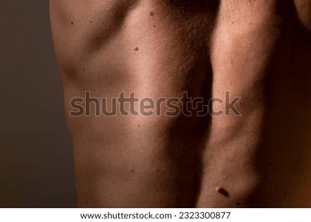 Male body parts macro texture of human skin. Close up shot of young male body back spine skin with imperfections. Skincare, bodycare, healthcare, hygiene Royalty-Free Stock Photo #2323300877