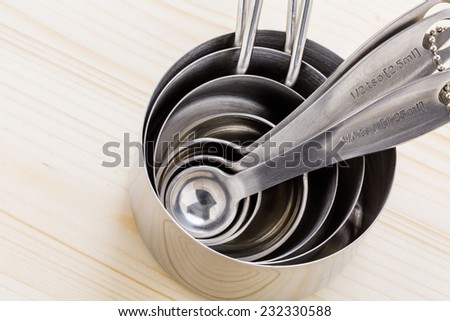 Measuring cups and spoons on the table. Royalty-Free Stock Photo #232330588