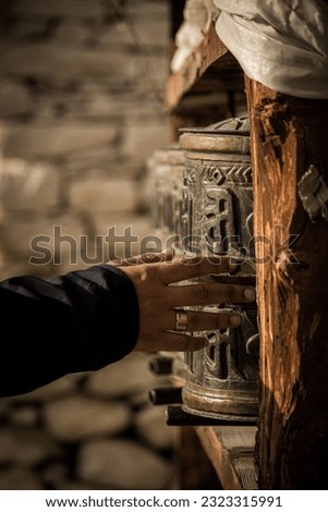 It is a photo of prayer wheel which followers of Lord Buddha use and chant a Mantra. Royalty-Free Stock Photo #2323315991