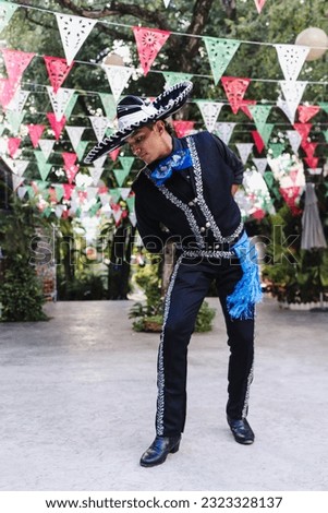 Latin man wearing as Traditional Mexican mariachi at parade or cultural Festival in Mexico Latin America, hispanic people in independence day or cinco de mayo Royalty-Free Stock Photo #2323328137