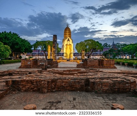 Standing Buddha image it time evening the landmark in Phitsanulok Province, Thailand.