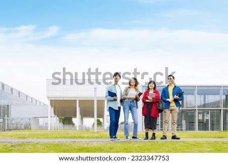 Multinational student group smiling on campus. Royalty-Free Stock Photo #2323347753