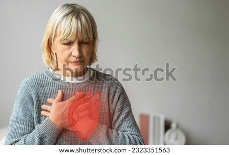 Senior adult elderly woman with chest pain suffering from heart attack, health and medical, heart health,  heart attack, world heart day, cardiovascular disease.insurance and hospital concept Royalty-Free Stock Photo #2323351563