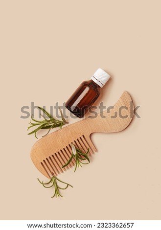 Rosemary Hair Oil, a trending hair care product, nourishing and revitalizing properties. Oil is enriched with natural rosemary extract, which helps stimulate hair growth, strengthen hair follicles. Royalty-Free Stock Photo #2323362657