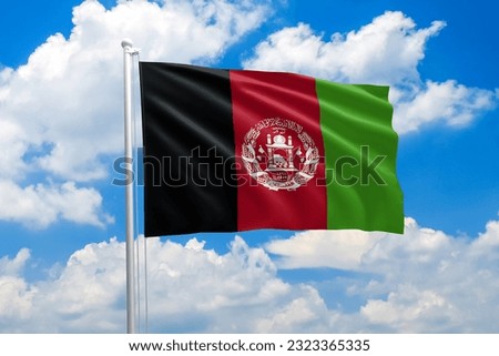 Afghanistan national flag waving in the wind on clouds sky. High quality fabric. International relations concept
