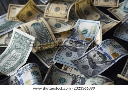 Money, US dollar bills background. Money scattered on the desk. Photography for Finance concepts.  Royalty-Free Stock Photo #2323366399