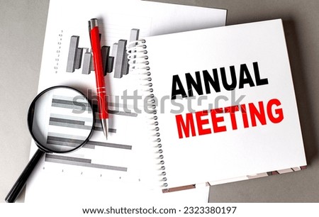 ANNUAL MEETING text written on a notebook with chart Royalty-Free Stock Photo #2323380197