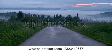 Mountain road during a foggy morning