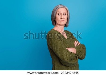 Photo of egoist selfish businesswoman pensioner wear khaki jumper folded hands look empty space arrogant isolated over blue background Royalty-Free Stock Photo #2323424845