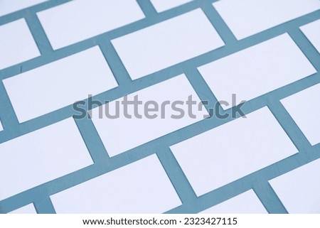 A lot of empty business cards on a blue background