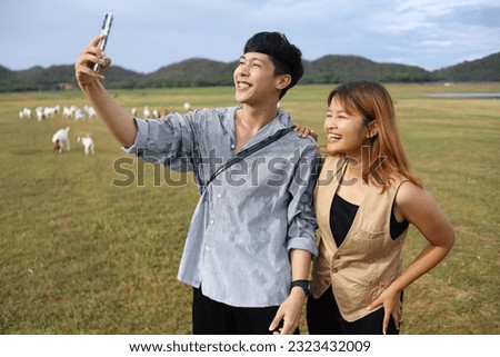 couple taking photo with digital camera.