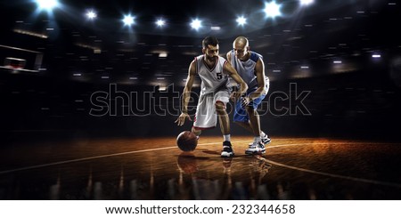 Two basketball players in action in gym  panorama view