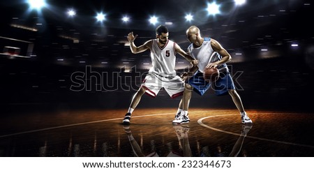 Two basketball players in action in gym panorama view