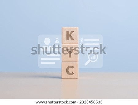 KYC - letters on wooden cubes. Know Your Customer card with human and magnifying glass and information icons. Business verifying the identity of your client concept. Financial client authentication.