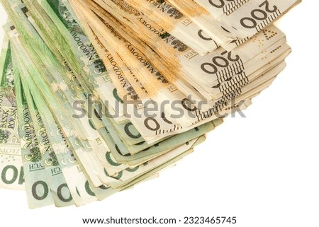 A large stack of Polish 100 and 200 zloty banknotes on a white background.  Synonymous with wealth and abundance. Royalty-Free Stock Photo #2323465745