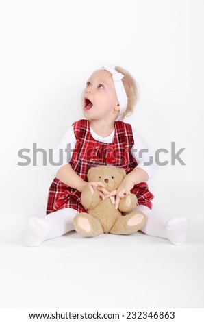 Young girl poses for a picture on white background