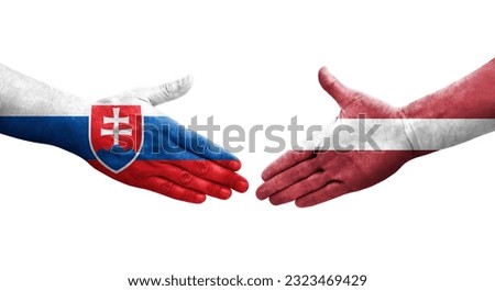 Handshake between Latvia and Slovakia flags painted on hands, isolated transparent image.