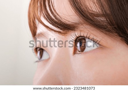 Up the eyes of a young Japanese woman Royalty-Free Stock Photo #2323481073