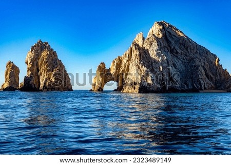 Nice image of the arch of Cabo San Lucas in the Gulf of California linking the sea of cuts with the Pacific Ocean at the land's end in Baja California Sur. Beach concept in Mexico.