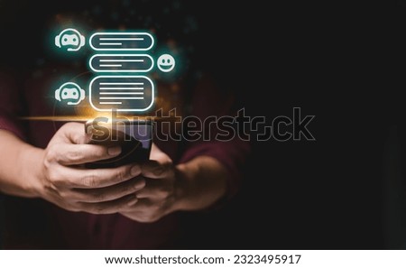 ai chatbot concept, a person holding a smartphone with a glowing screen on it's display, with a chat bubbles above it.
