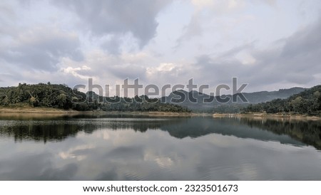 A lake with a mountainous background in Indonesia