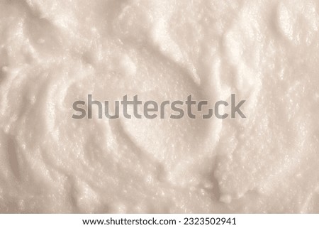 Baby food close-up. Porridge for newborns. Background food texture for kids. Milk mixture. Royalty-Free Stock Photo #2323502941