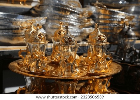 Golden tea set in Istanbul, Turkey. Traditional Turkish style tea serving glasses.