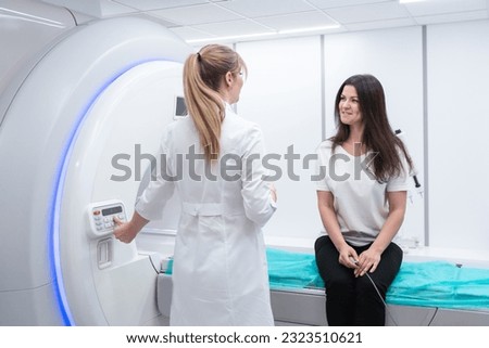 Female patient undergoing MRI - Magnetic resonance imaging in Hospital. Medical Equipment and Health Care Royalty-Free Stock Photo #2323510621