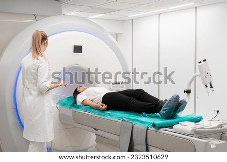 Medical CT or MRI Scan in the modern hospital laboratory. Interior of radiography department. Technologically advanced equipment in white room. Magnetic resonance diagnostics machine Royalty-Free Stock Photo #2323510629