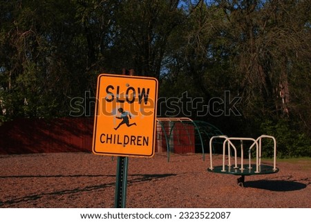 A slow children safety sign in a park