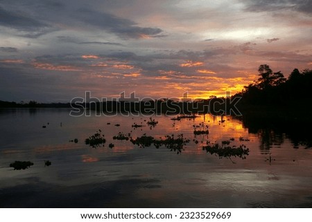 Beautiful sunset in the Cuipari Lake in Peruvian Jungle.