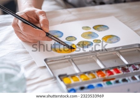 painting watercolor bubbles and brushes  Royalty-Free Stock Photo #2323533969