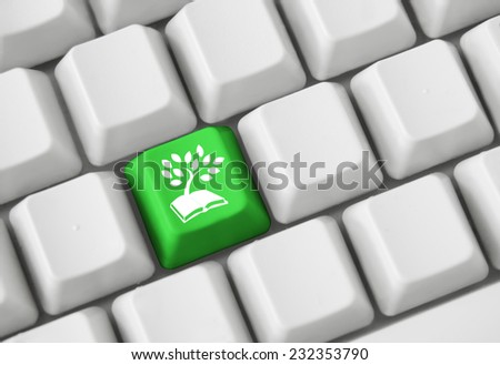 Color button on the keyboard with concept image (book and tree symbol)
