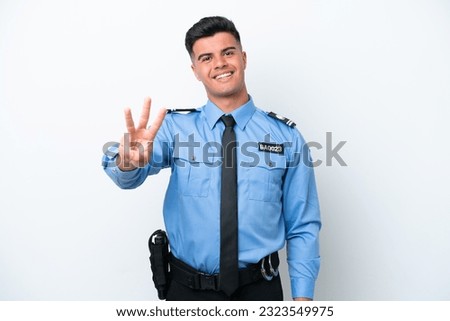 Young police caucasian man isolated on white background happy and counting three with fingers
