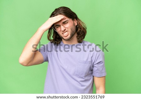 Young handsome man over isolated background with headache Royalty-Free Stock Photo #2323551769