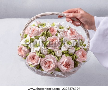 Zephyr bouquet of flowers in a gift box on a light background