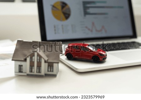 Car and house. Miniature car and house on white background.