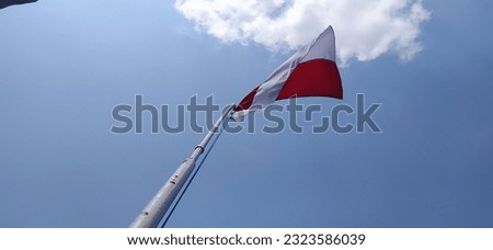 the red and white flag flutters mightily in our beloved country Indonesia
