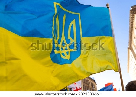 The Ukrainian flag with trident at peaceful demonstration, Ukraine flag waving