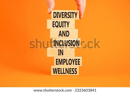 Diversity equity inclusion symbol. Concept words Diversity Equity and Inclusion in employee wellness on wooden block. Beautiful orange background. Diversity equity inclusion concept. Copy space.