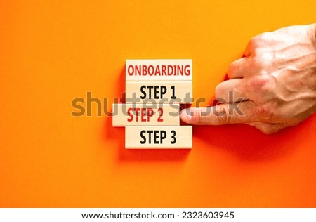 Time to step 2 onboarding symbol. Concept words Onboarding step 2 on wooden block. Businessman hand. Beautiful orange table orange background. Business success step 2 onboarding concept. Copy space.