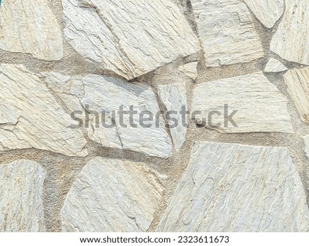 Background of stone wall texture photo. Closeup of stone wall texture.