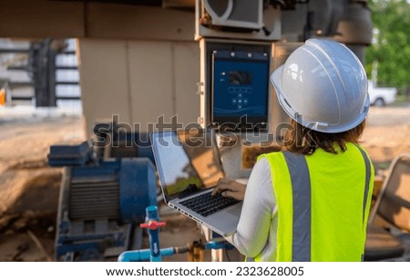 Environmental engineers work at wastewater treatment plants,Water supply engineering working at Water recycling plant for reuse,Check the amount of chlorine in the water to be within the criteria. Royalty-Free Stock Photo #2323628005