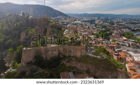 The old fortress in the city of Tbilisi. The historical center of the city of Batumi. View of Tbilisi from the Sololaka hill. Aero photo with drone. Traveling in Georgia, background with Tbilisi