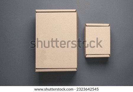Parcel cardboard boxes on a dark background. Top view