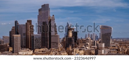 Panoramic aerial city scape about London city with skyscapers. Amazing sunny day with a bit cloudy sky. 
 Royalty-Free Stock Photo #2323646997