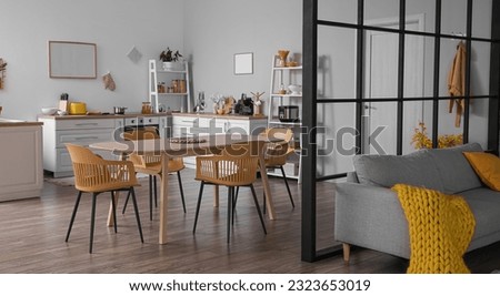 Modern studio apartment interior with kitchen and sofa Royalty-Free Stock Photo #2323653019