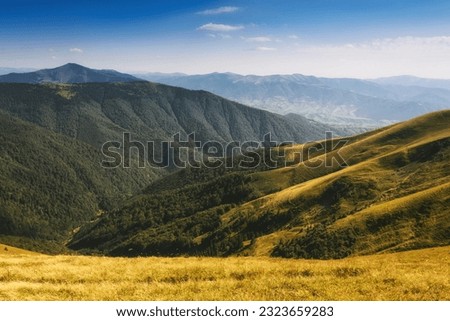 Amazing landscape scenic mountains in summer. View of light and afternoon shadow over  hills and clear blue sky.